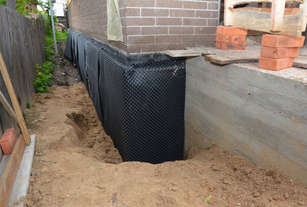 SJ Waterproofing Pros technician performing targeted Basement Waterproofing assessment in Dresden, TN